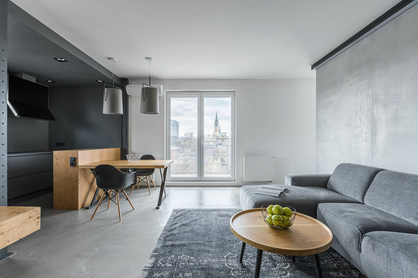 Seamless flooring connecting an open kitchen and living room