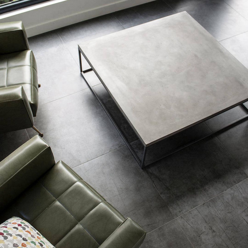 Square grey coffee table with black metal legs