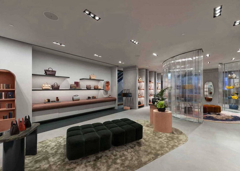 Light grey flooring around bag displays and seating