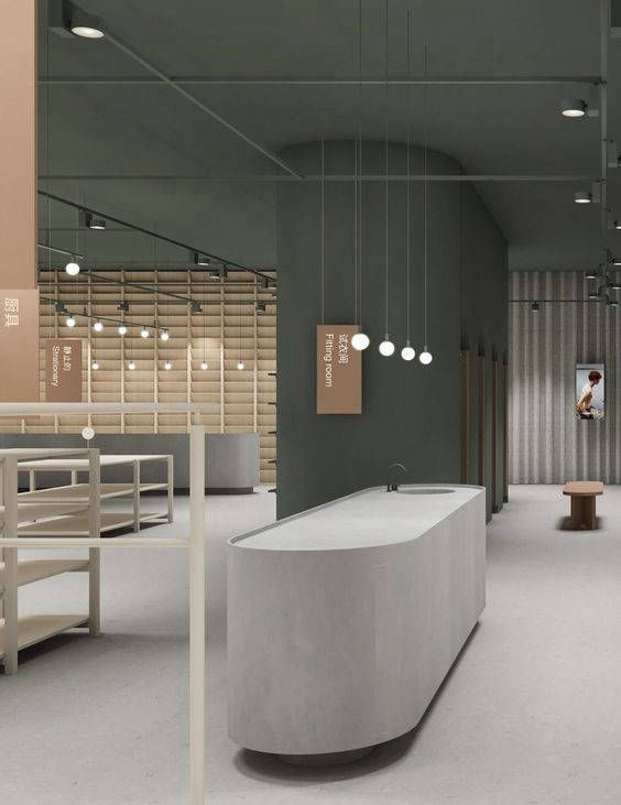 Grey reception desk with rounded ends in an open office